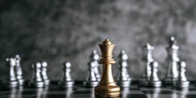 Gold and Silver Chess on chess board game for business metaphor